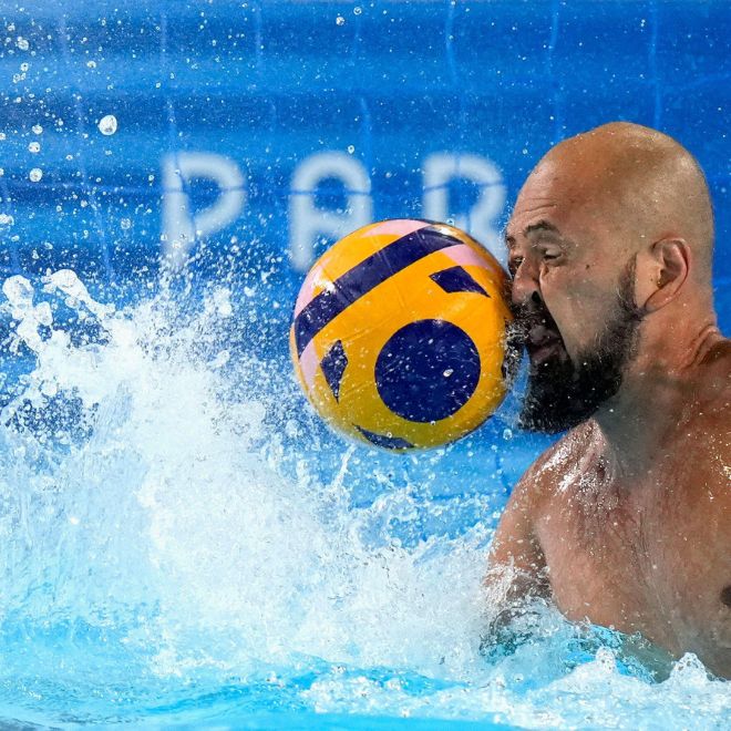 Japan's Katsuyuki Tanamura reaches for a shot during a Japan men's water polo team training session at the Olympic Aquatics Centre, ahead of the 2024 Summer Olympics, Tuesday, July 23, 2024, in Saint-Denis, France. 